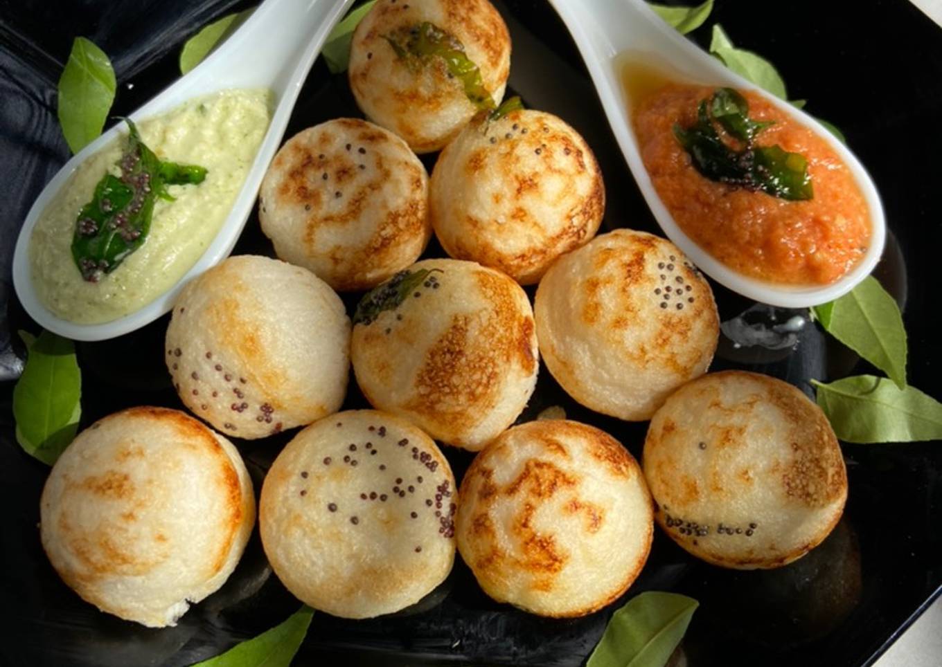 Paddu with red and green coconut chutney