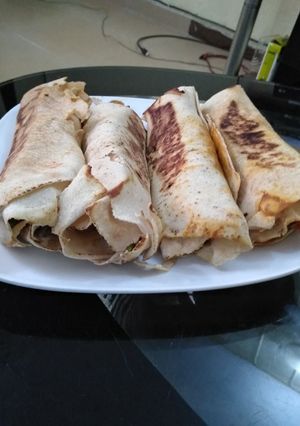 A picture of Pan grilled chicken veggies and avocado wrap.