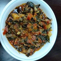 A picture of Fenugreek leaves and carrot potato veggies.
