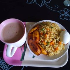 A picture of Noddles and fried plantain.