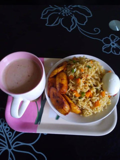 A picture of Noddles and fried plantain.