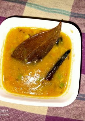A picture of Arhar dal with raw mango.