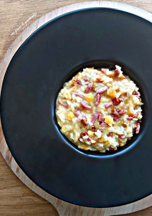 Une photo de Risotto courge butternut, tomates confites, bacon et reblochon