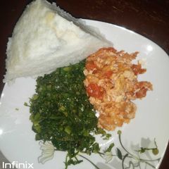 A picture of Fried Eggs Kales and Ugali(Dinner).