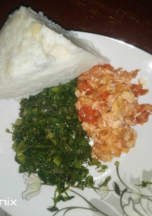 A picture of Fried Eggs Kales and Ugali(Dinner).