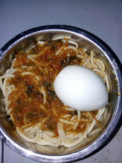 A picture of Spaghetti and stew with egg.