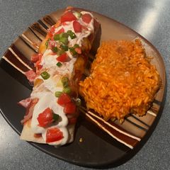 A picture of Beef & Pepper Homemade enchiladas with rice.