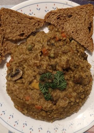 Una foto de Arroz meloso de cerdo con vino tinto