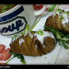 A picture of Hasselbeck potatoes with yummy carrot and coriander soup.