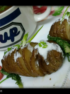 A picture of Hasselbeck potatoes with yummy carrot and coriander soup.