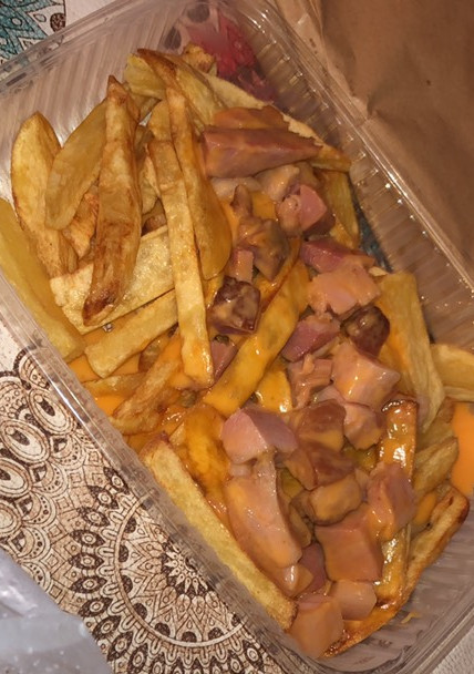 Una foto de Papas con cheddar