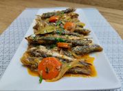 Una foto de escabeche de pescado