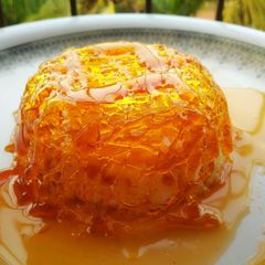 A picture of Creme caramel with sugar cage.
