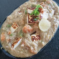 A picture of Vegetable Paneer korma in white gravy.