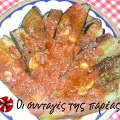 A picture of Fried vegetables in tomato sauce.