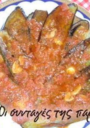A picture of Fried vegetables in tomato sauce.