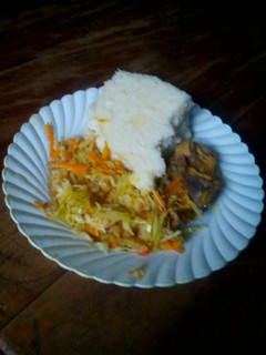 A picture of Ugali with fried cabbage and stewed meat.