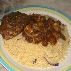 A picture of Steamed couscous with stew.