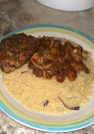A picture of Steamed couscous with stew.