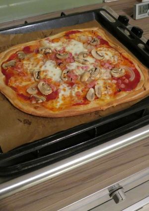 A picture of Oven tray pizza.