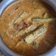 A picture of Drumstick Curry with Coconut and Peanuts.