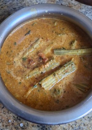 A picture of Drumstick Curry with Coconut and Peanuts.