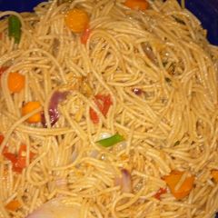 A picture of Stir fried pasta with smoked fish.