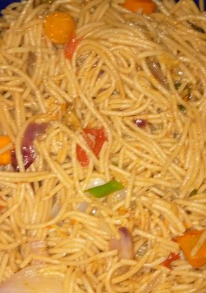A picture of Stir fried pasta with smoked fish.