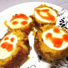 A picture of Potato scotched eggs.