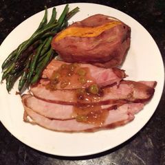 A picture of Glazed Baked Ham w/ Rum-Raisin Sauce.