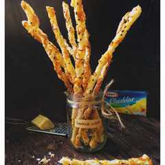 A picture of Puff pastry Cheese and sesame seeds straws.