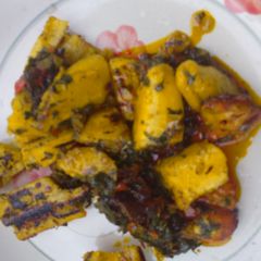 A picture of Roasted plantain and vegetable sauce.