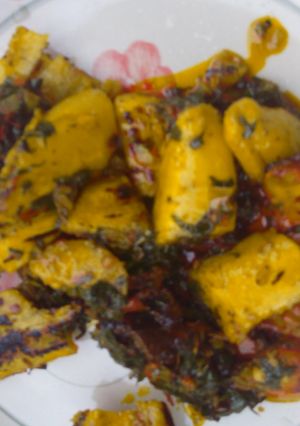 A picture of Roasted plantain and vegetable sauce.