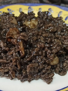 Una foto de Arroz negro con sepia