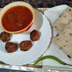 Bottle gourd kofte in Air Fryer in leftover tomato soup A picture of Bottle gourd kofte in Air Fryer in leftover tomato soup.