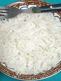 A bowl Of Steaming Hot Basmati Rice In A Pressure Cooker