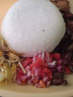 A picture of Fried Pork Kachumbari n Ugali.