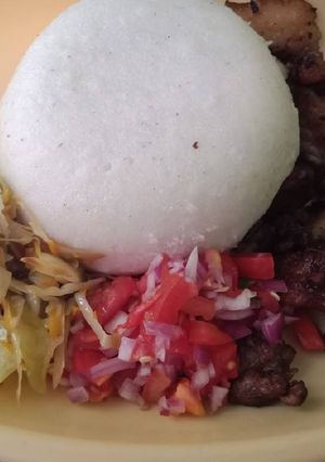 A picture of Fried Pork Kachumbari n Ugali.