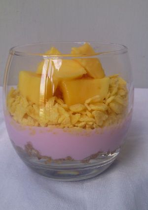 A picture of Blackcurant Yoghurt Mango Cereal Parfait.