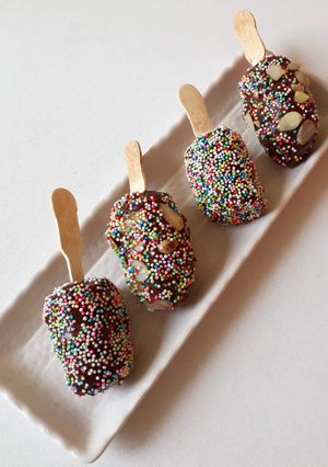 A picture of Frozen banana with nutella spread.