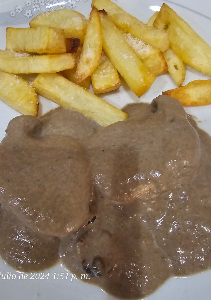 Una foto de Solomillo de cerdo con salsa de champiñones