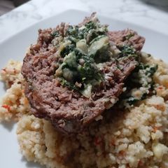 A picture of Spinach Artichoke dip Stuffed Meatloaf.