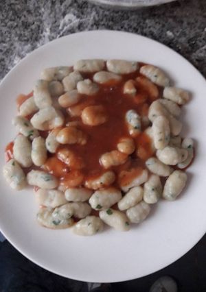 Una foto de Ñoquis de ricota y perejil
