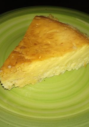Una foto de Flan de coco y 🍊