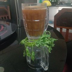 A picture of Mix vegetable soup with mint.