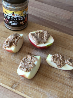 A picture of Peanut butter on apple.