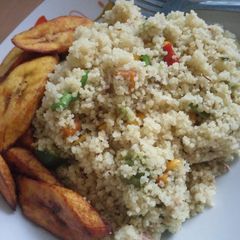 A picture of Veggie couscous and fried plantain.