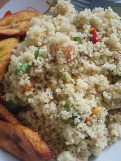 A picture of Veggie couscous and fried plantain.