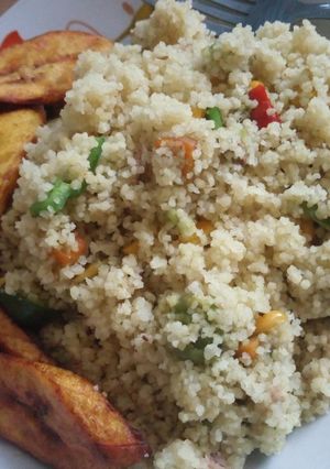 A picture of Veggie couscous and fried plantain.