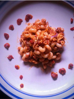 A picture of Macaroni in tomato based sauce.